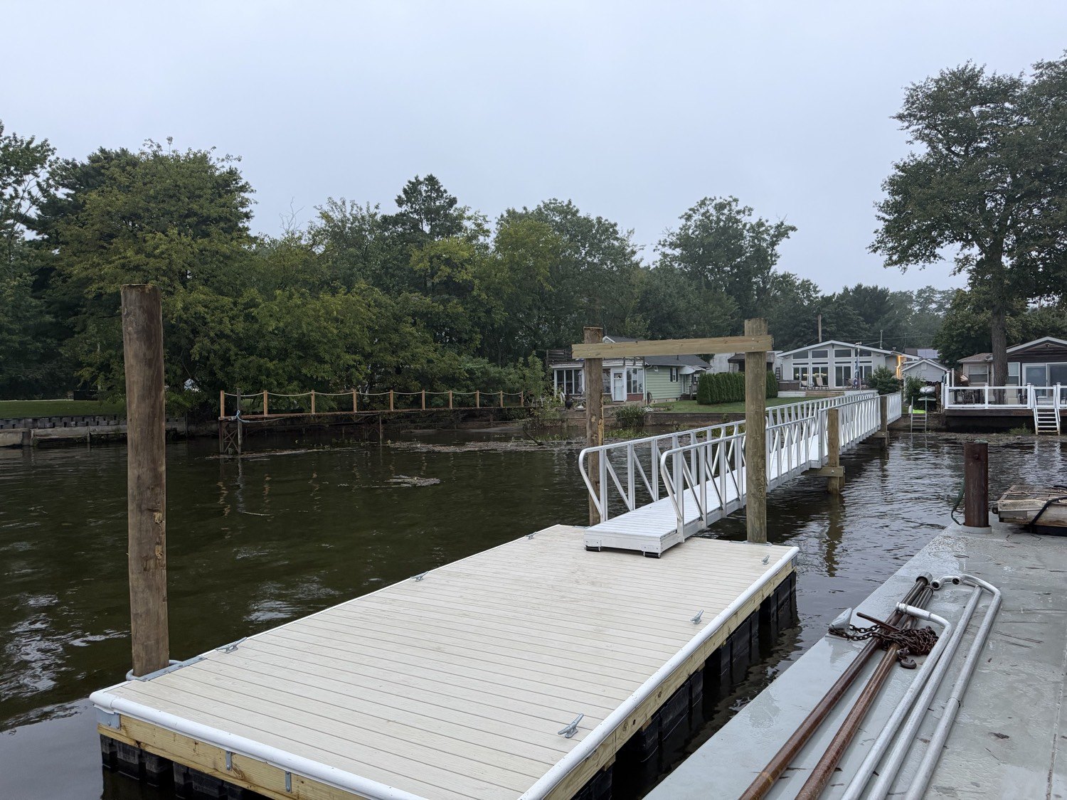 New floating dock with timber pile and aluminum ramp
