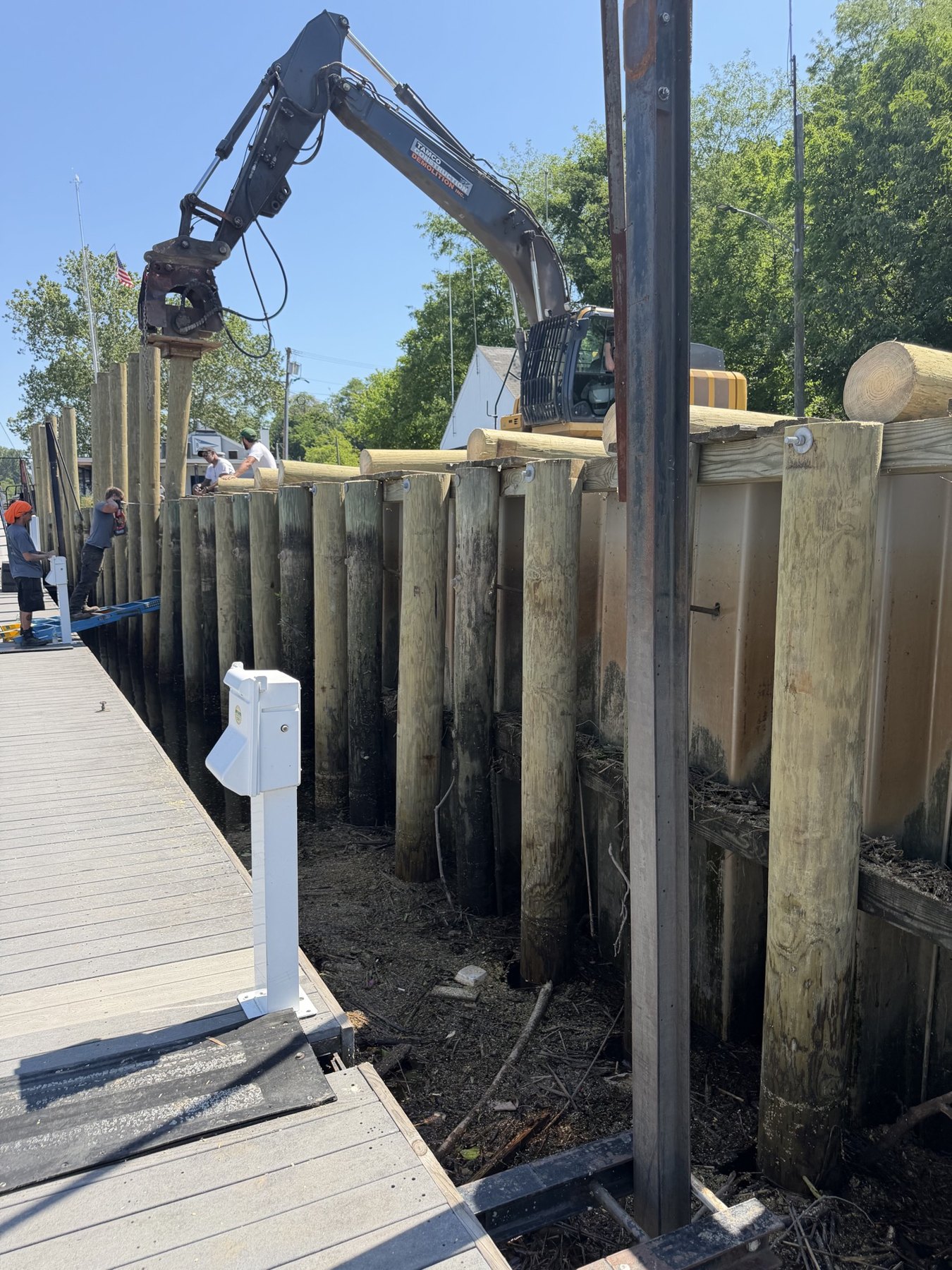 Timber pile bulkhead reconstruction along a marina dock